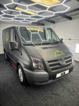 South Coast Wrapping Stealth Black Transit with Signwriting