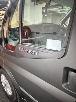 South Coast Wrapping Stealth Black Transit with Signwriting