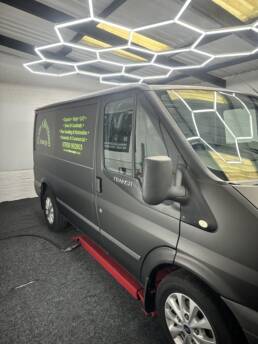 South Coast Wrapping Stealth Black Transit with Signwriting