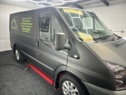 South Coast Wrapping Stealth Black Transit with Signwriting