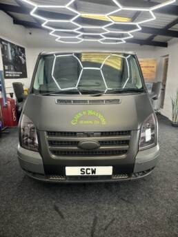 South Coast Wrapping Stealth Black Transit with Signwriting