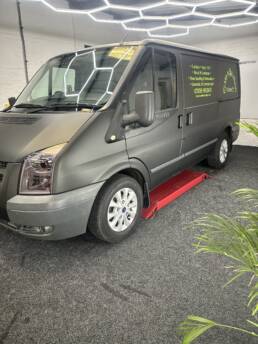 South Coast Wrapping Stealth Black Transit with Signwriting