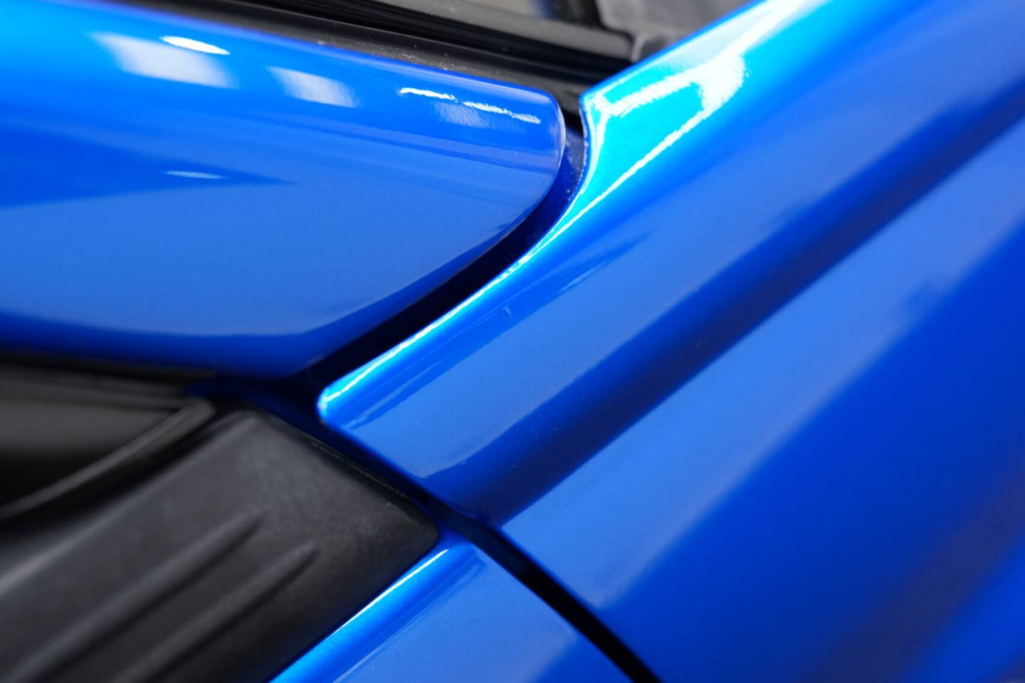 Blue Subaru Impreza wing mirror and door detail