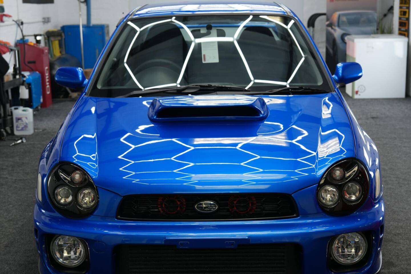 Front view of a blue Subaru Impreza