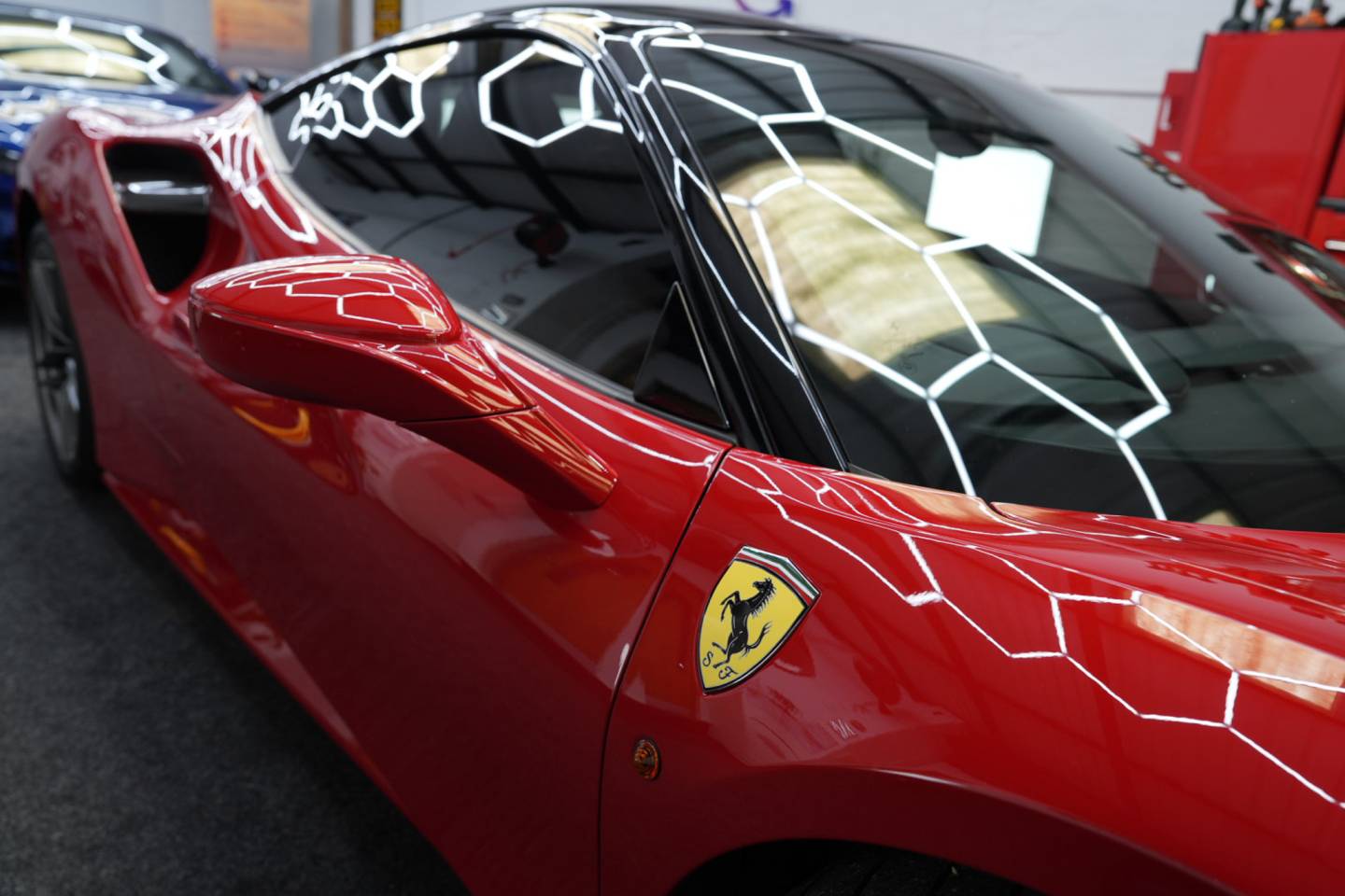 Red sports car rear window and bodywork