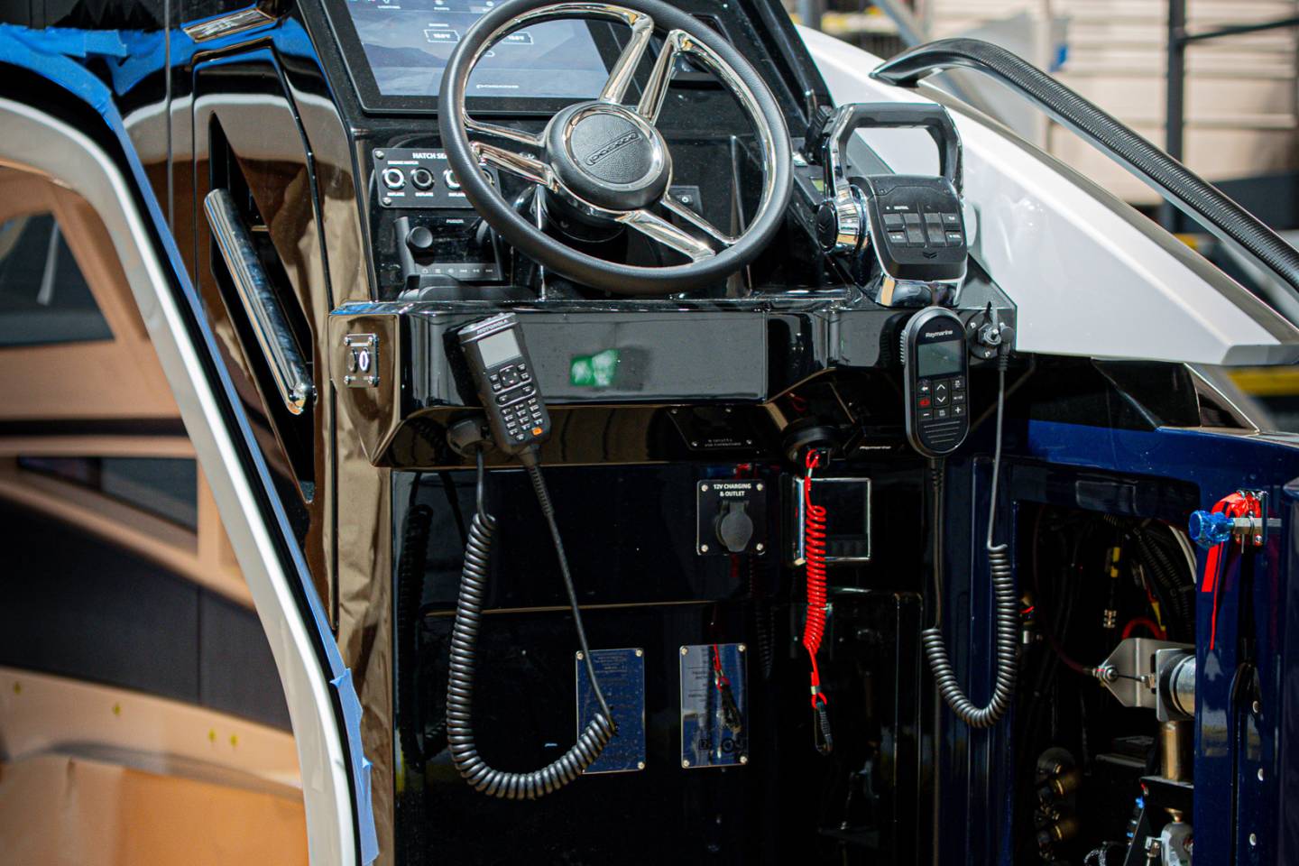 Open cockpit and dashboard of a blue classic sports car