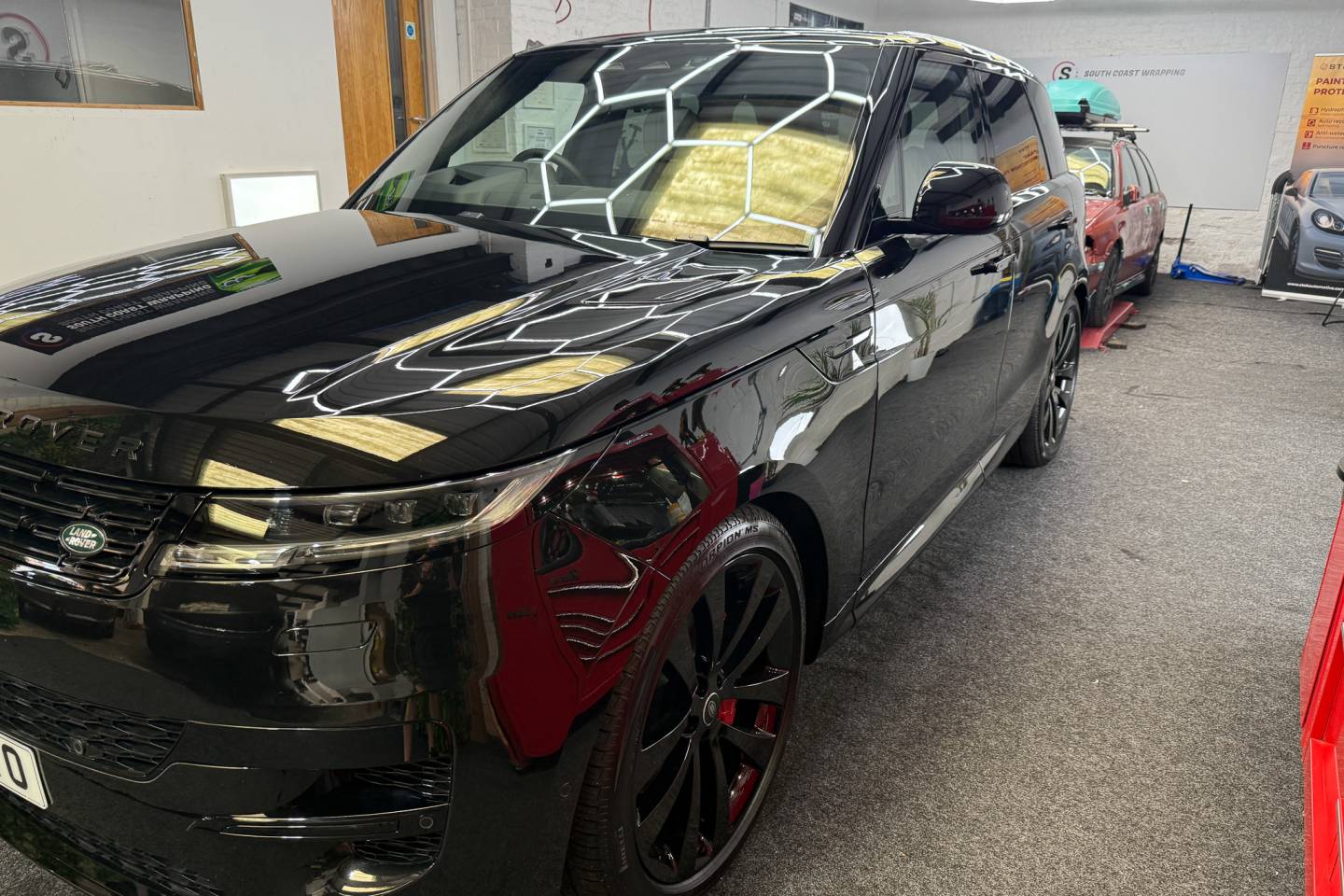 Front three-quarter view of a black Range Rover