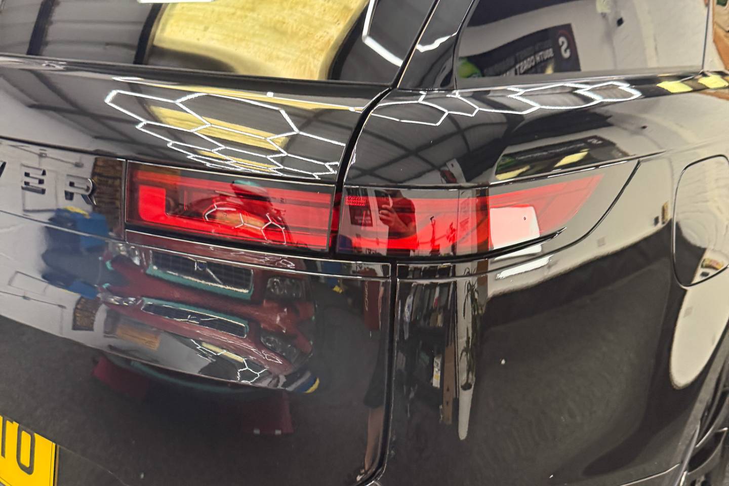 Rear three-quarter view of a black Range Rover