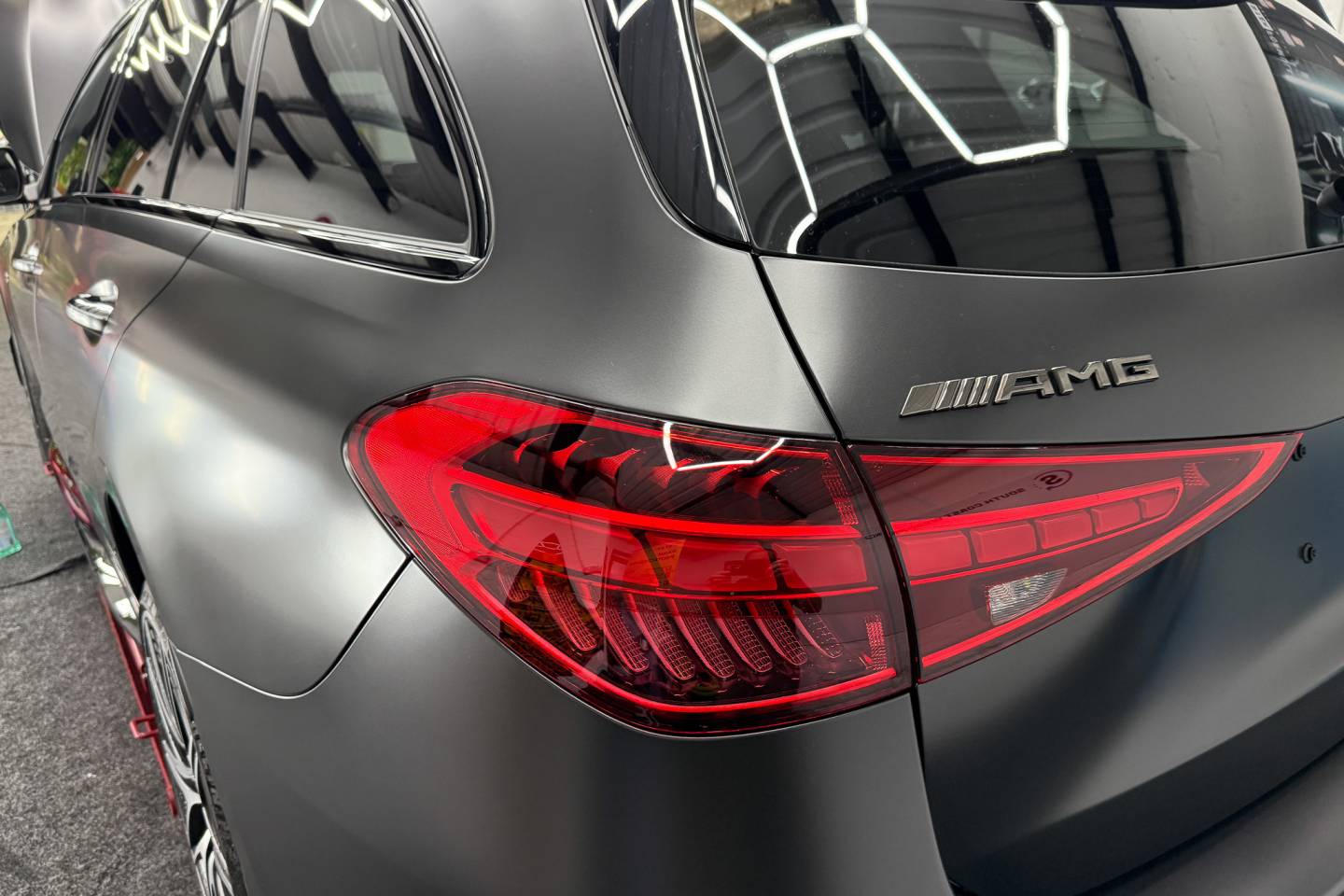 Rear corner of a matte grey Mercedes estate