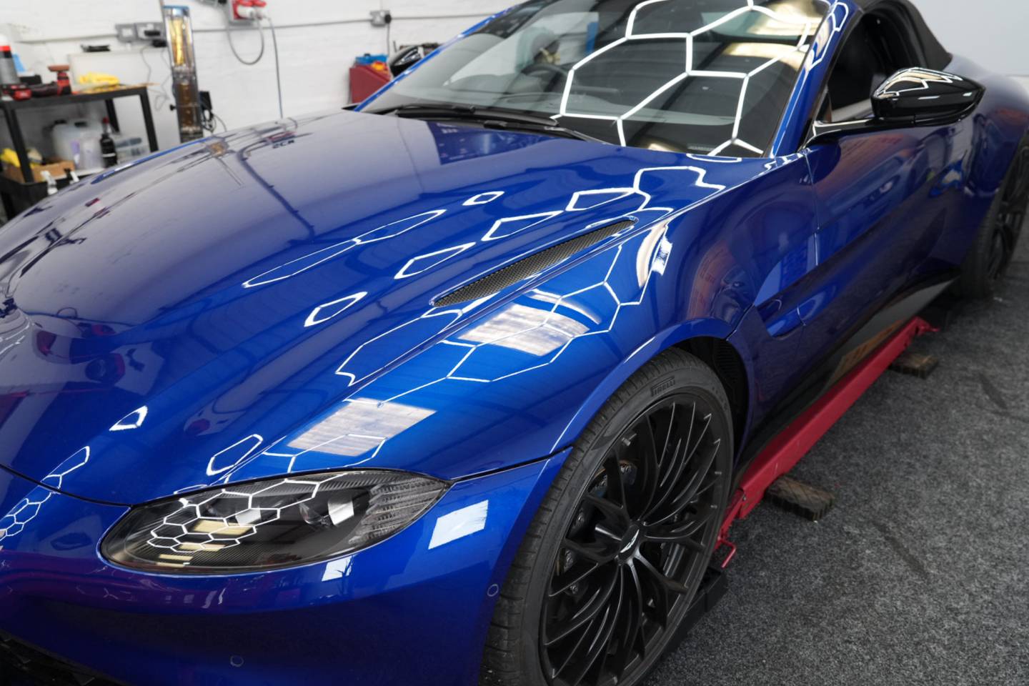 Front three-quarter view of a blue sports car