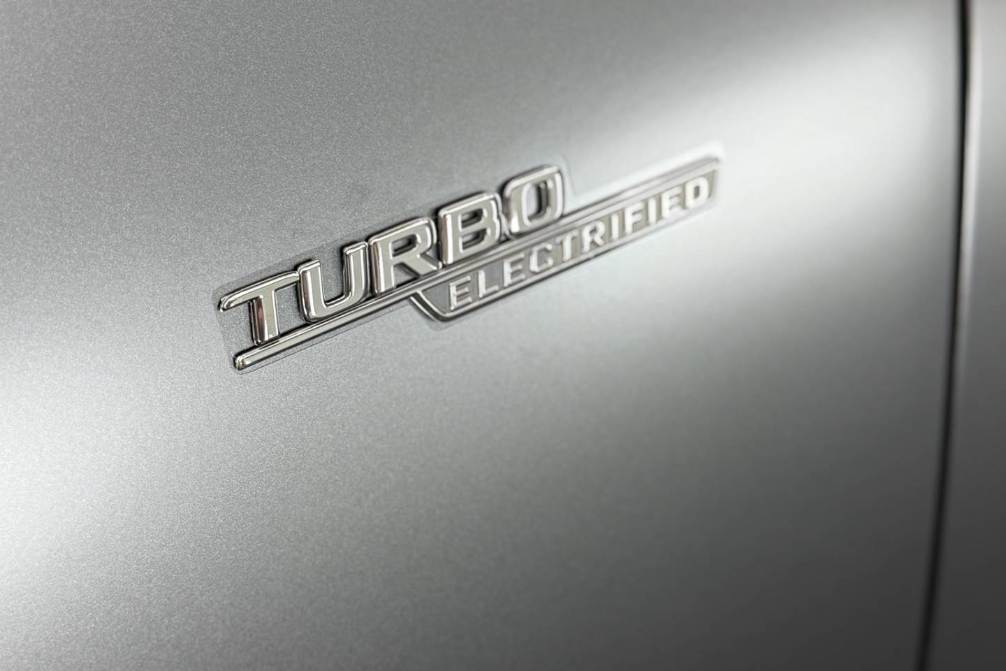 Turbo badge on a matte-finish Mercedes body panel