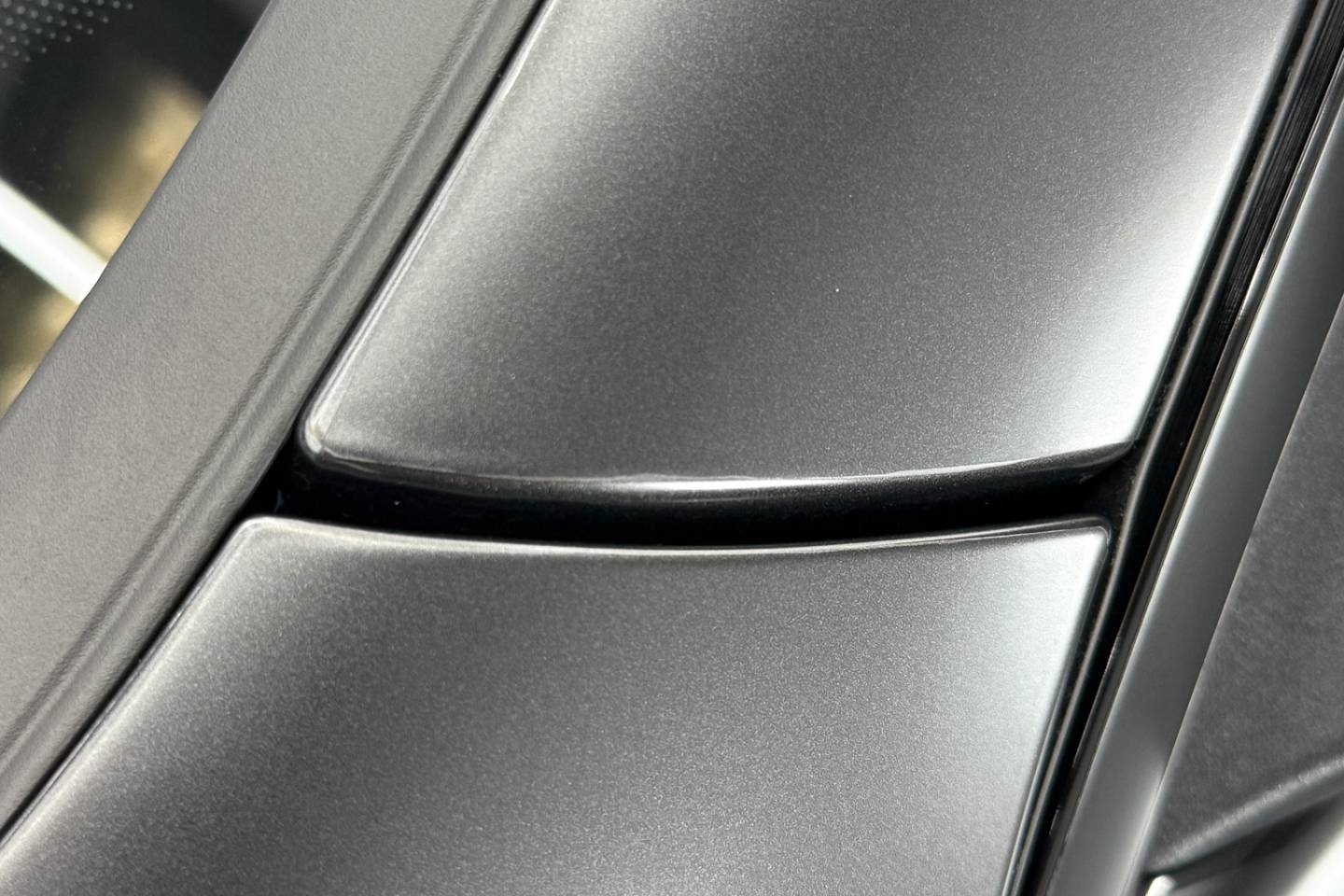 Matte paint protection film finish around a vehicle window pillar