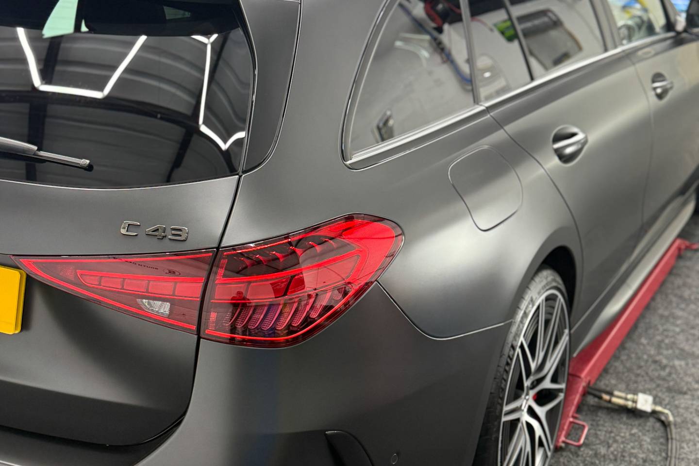 Rear three-quarter view of a matte grey Mercedes estate