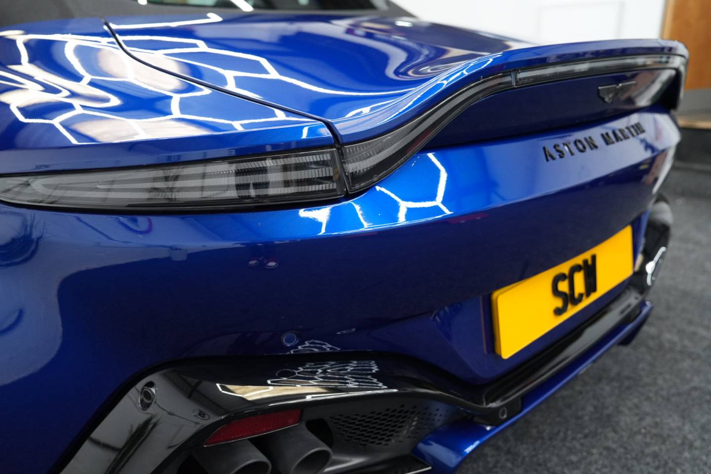 Blue sports car rear light and bodywork detail