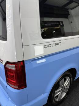 Blue and white VW Transporter Ocean rear quarter
