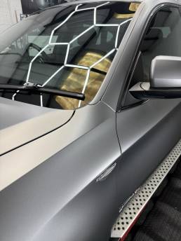 Satin grey BMW X6 bonnet and windscreen detail