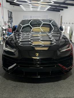 Front view of black Lamborghini Urus at South Coast Wrapping