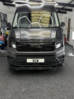 Front view of satin grey MAN van
