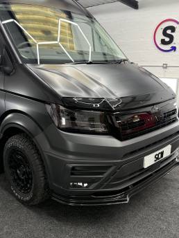 Front three-quarter view of satin grey MAN van