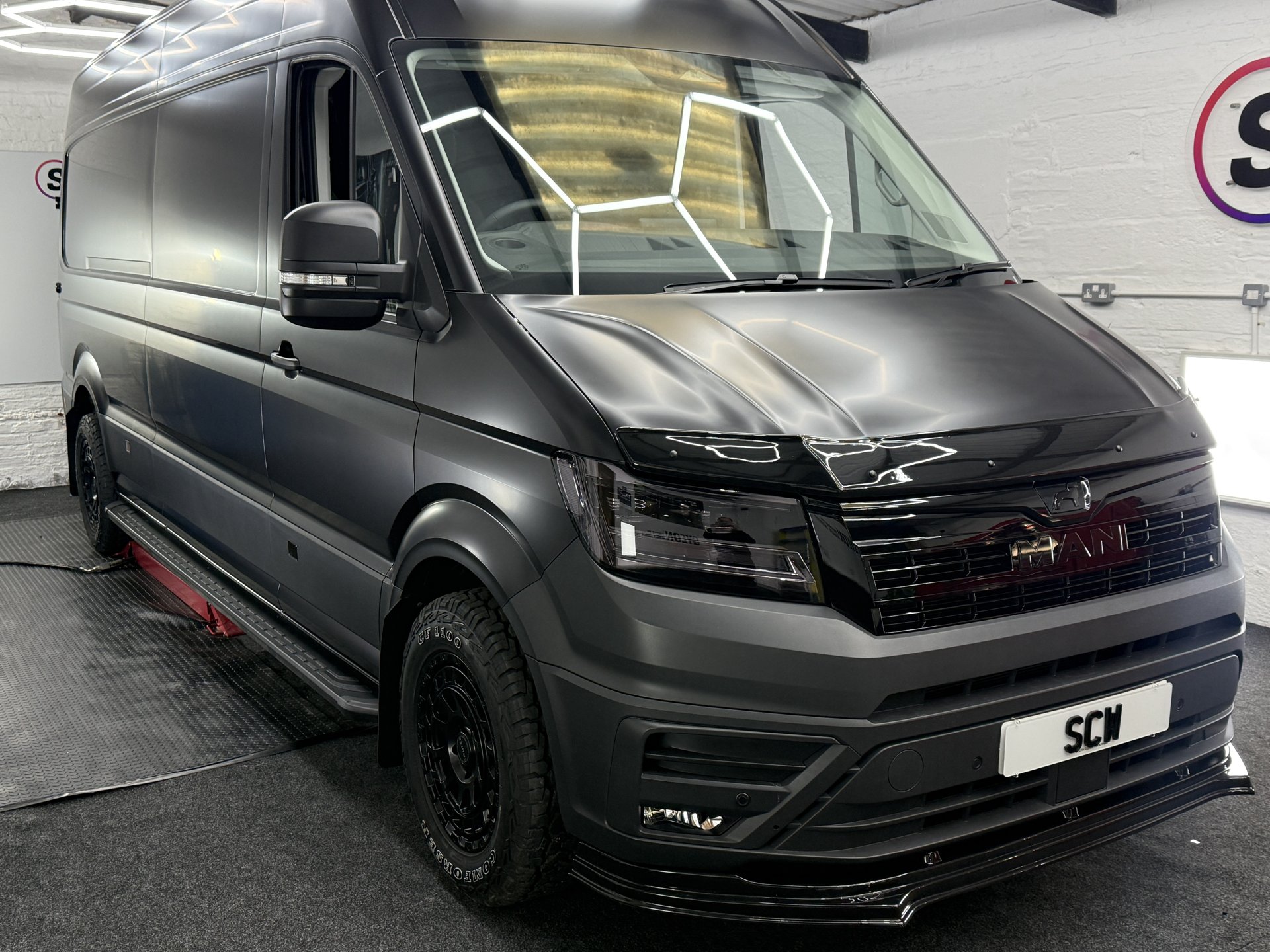 Satin grey MAN van side and front view