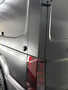 Satin grey MAN van rear corner and light