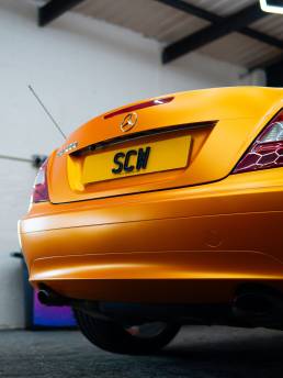 Rear view of orange Mercedes-Benz SLK 200