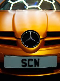 Orange Mercedes-Benz SLK grille and badge