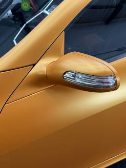 Orange Mercedes-Benz SLK wing mirror and door