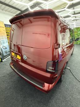 Rear view of red VW Transporter