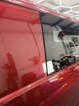 Gloss red VW Transporter side panel and window