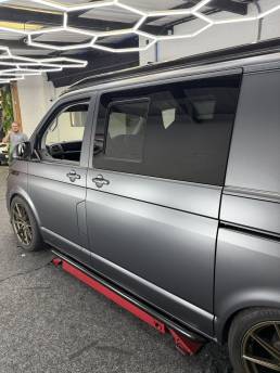 Side view of satin grey VW Transporter with bronze wheels